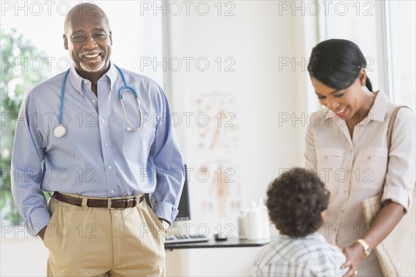 Mother and son seeing doctor