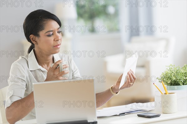 Black businesswoman working at desk