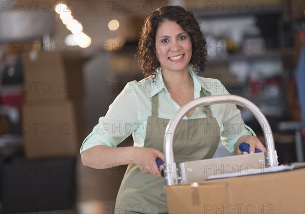 Hispanic woman working in warehouse