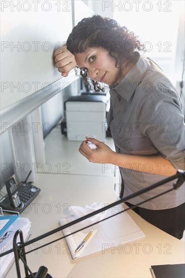 Hispanic businesswoman working in office