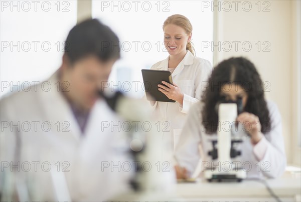 Scientists working in laboratory