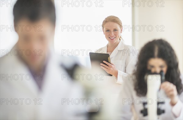 Scientists working in laboratory