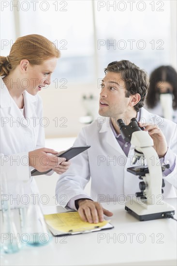 Scientists working in laboratory