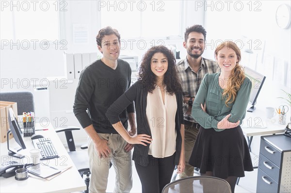 Business people smiling together in office