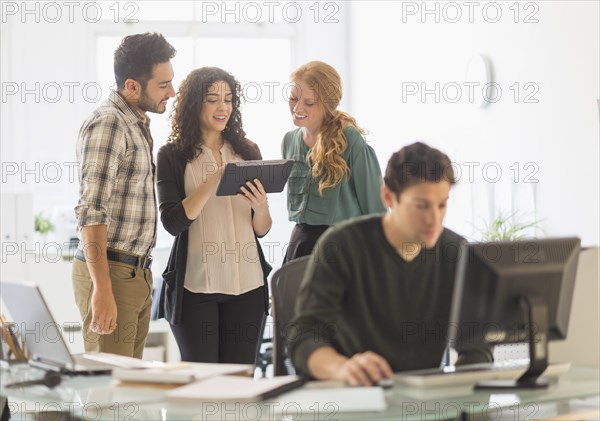 Business people using digital tablet in office