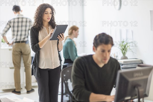 Businesswoman using digital tablet in office