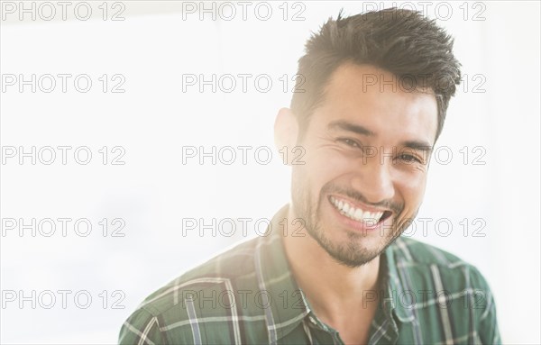 Mixed race man smiling