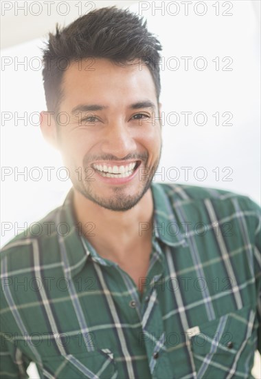 Mixed race man smiling