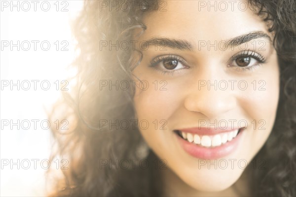 Mixed race woman smiling
