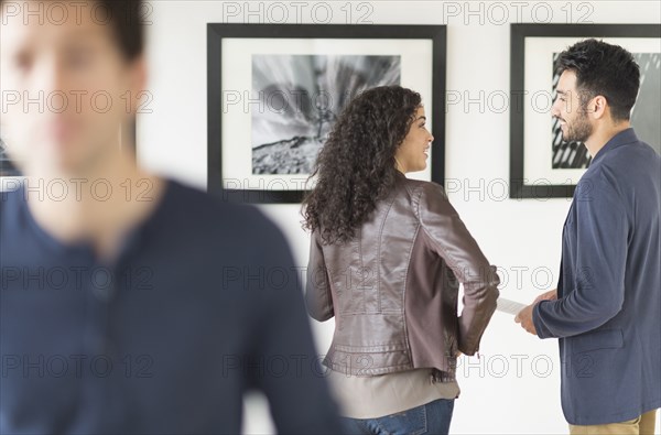 Couple admiring art in gallery