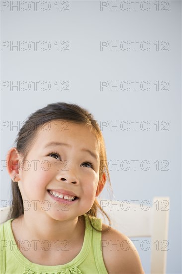 Korean girl smiling and looking up