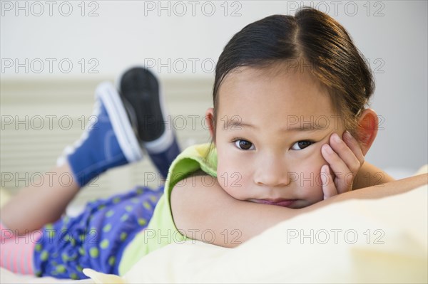 Korean girl laying on bed