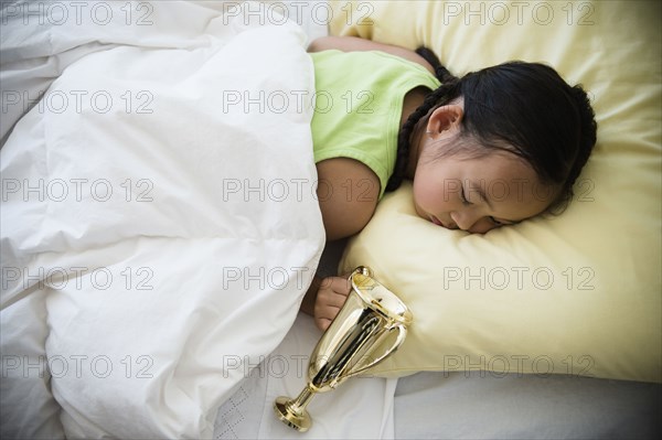 Korean girl sleeping with trophy