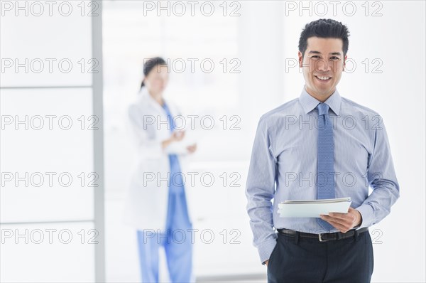 Businessman smiling in hospital