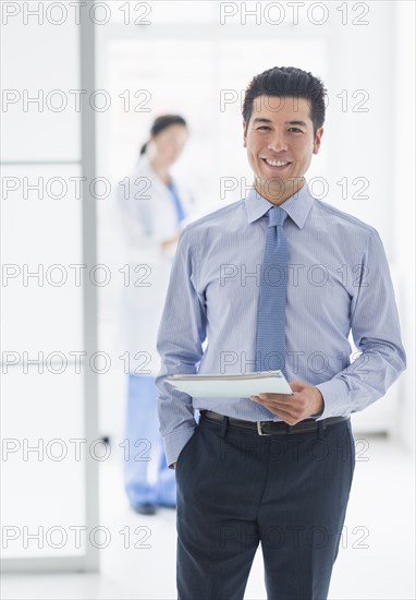 Businessman smiling in hospital