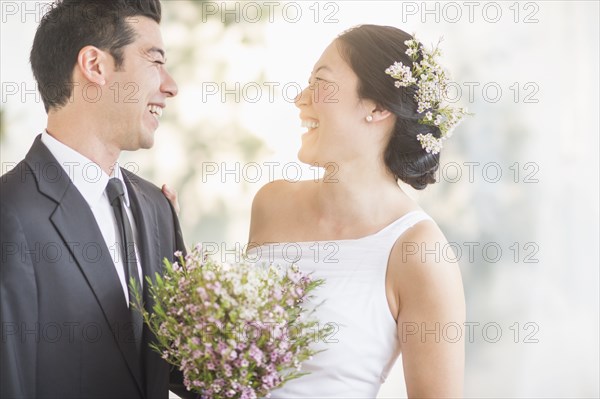 Newlywed couple laughing