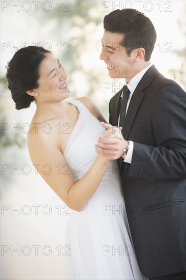 Newlywed couple dancing at wedding reception