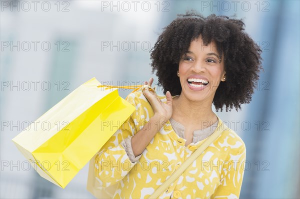 African American woman with shopping bag