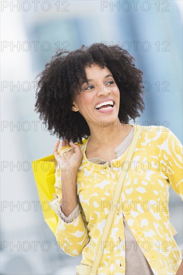 African American woman with shopping bag