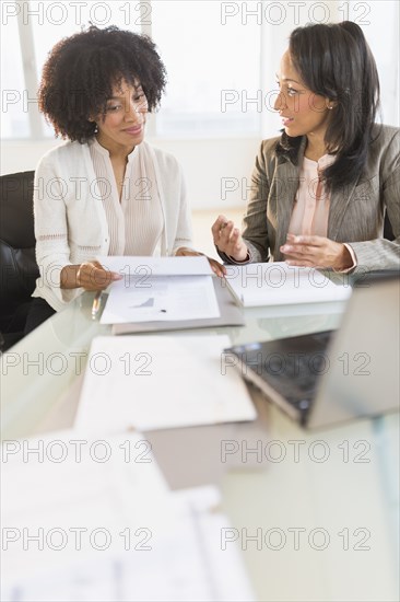 African American businesswomen talking in meeting