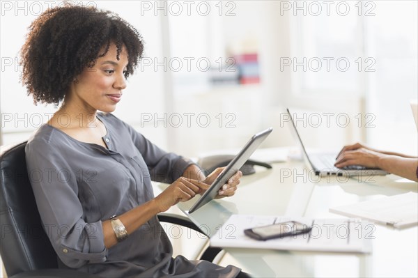 African American businesswoman using digital tablet