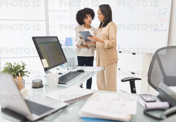 African American businesswomen working in office
