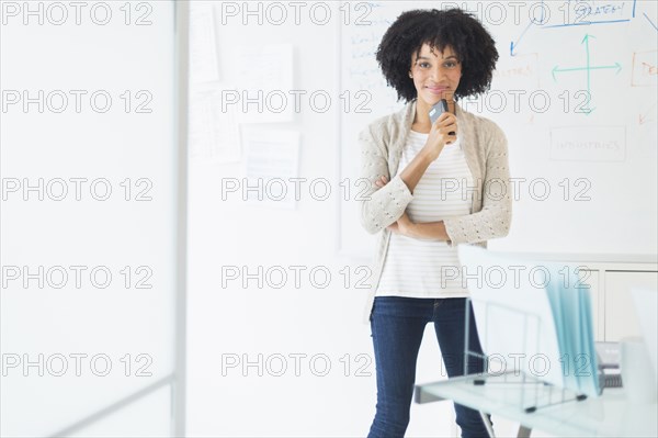 African American businesswoman smiling in office