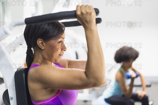 African American woman working out in gym