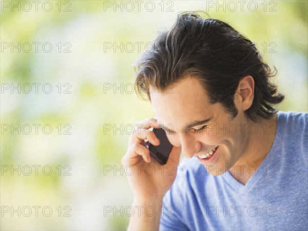 Caucasian man talking on cell phone