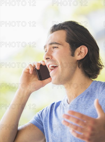 Caucasian man talking on cell phone