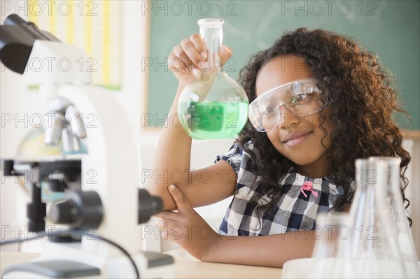 Mixed race student working in chemistry lab