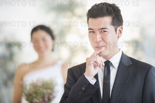 Groom smiling in wedding ceremony