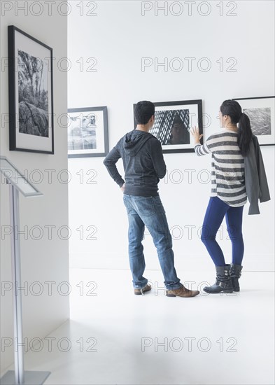 Couple admiring art in gallery