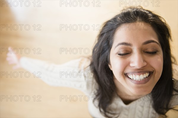 Close up portrait of carefree Asian woman with eyes closed