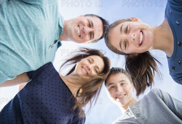 Portrait of smiling Caucasian family in huddle