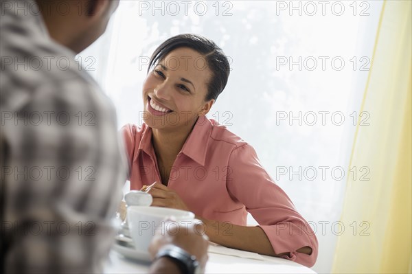 Happy couple drinking coffee