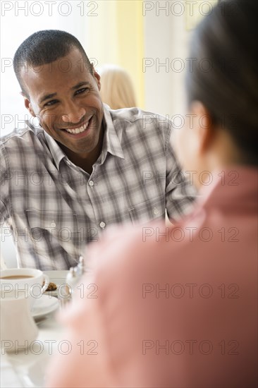 Happy couple drinking coffee