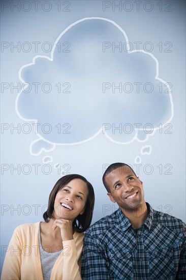 Shared thought bubble above pensive couple