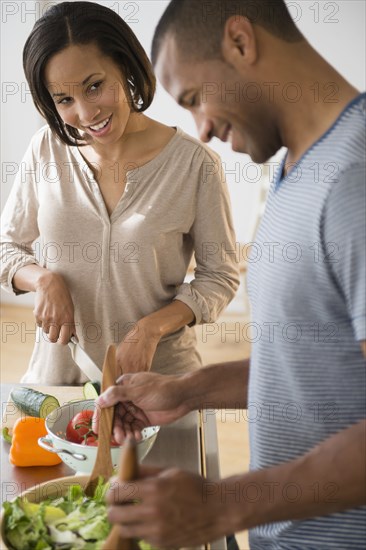 Couple preparing salad