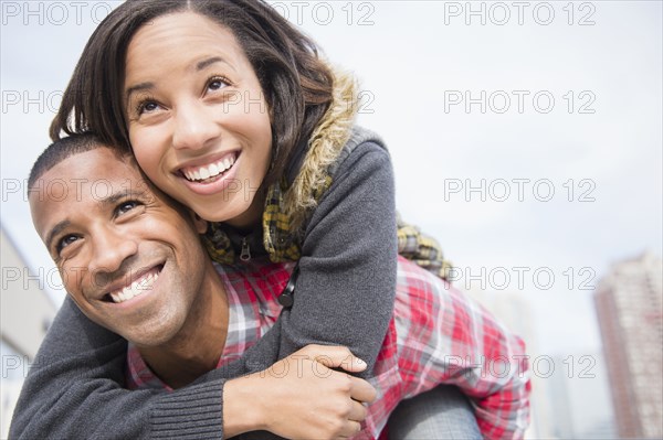 Happy couple piggybacking