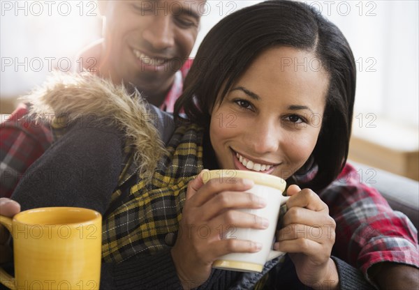 Portrait of happy couple drinking coffee