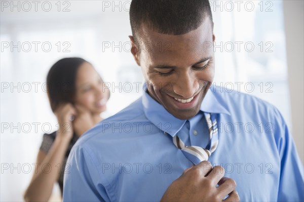 Businessman getting dressed