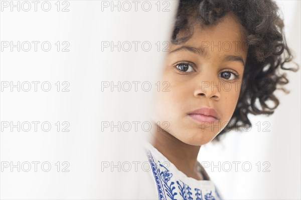 Close up portrait of serious African American girl