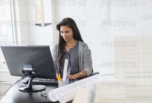 Hispanic architect working in office