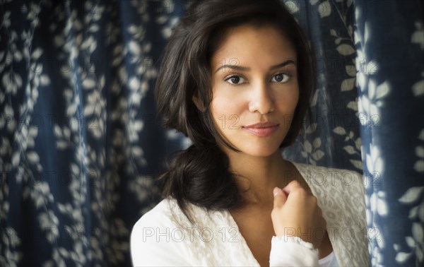 Hispanic woman smiling indoors