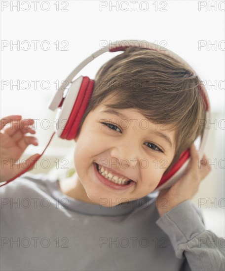 Hispanic boy listening to headphones