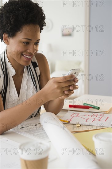 Black businesswoman using cell phone