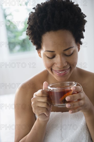 Close up of Black woman enjoying tea