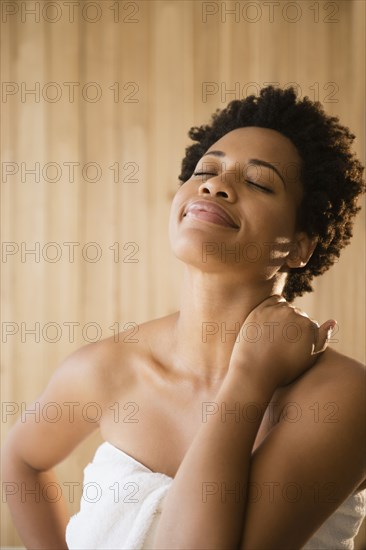 Serene Black woman wrapped in a towel