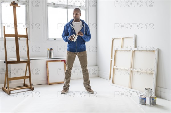 Black artist standing in studio